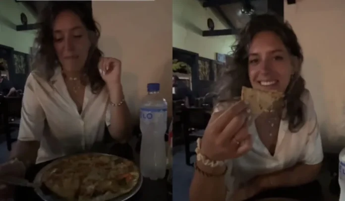 La mujer invitó a sus compatriotas a probar la pizza hawaiana.